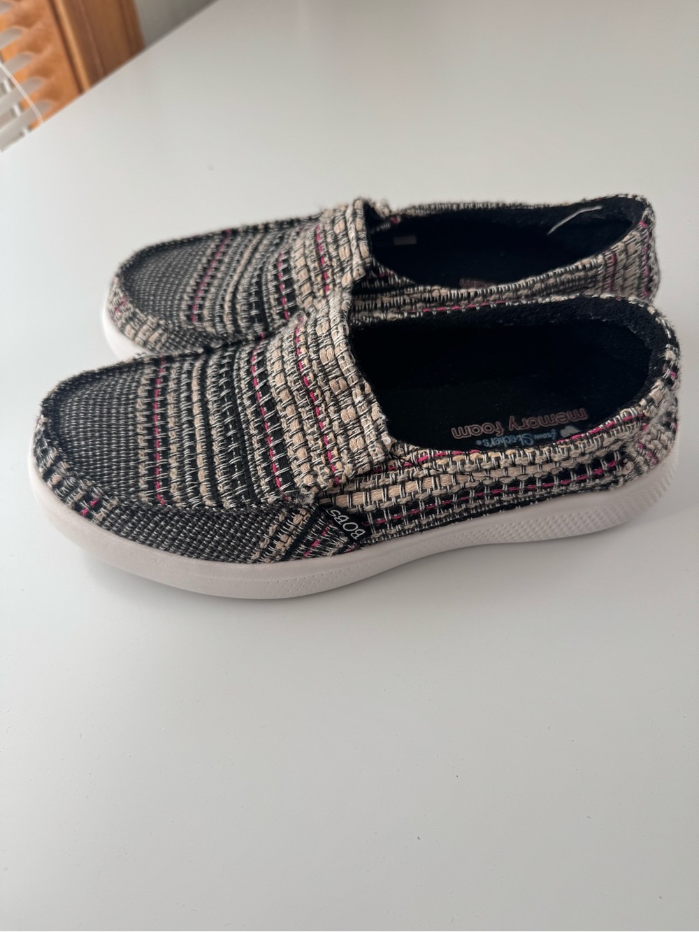 Skechers Women’s Slip-On Sneakers in Black, Cream & Pink Accent
